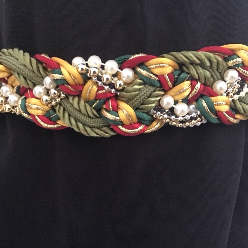 Belt.  Braided, beaded cord with clasp.